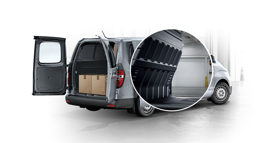 Rear view of ultimate multipurpose van with the doors open and highlight shot of partition panel