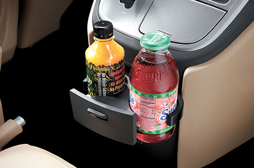 Closer view of H-1's cup holders with 2 beverage bottles
