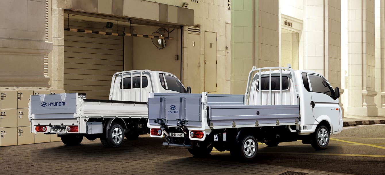 Rear photo of a power gate and transformer power gate vehicle parked at a shipping location