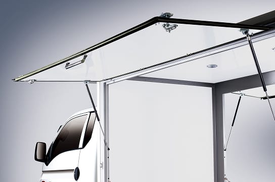 Close-up photo of the side door of the vehicle open and secured upwards