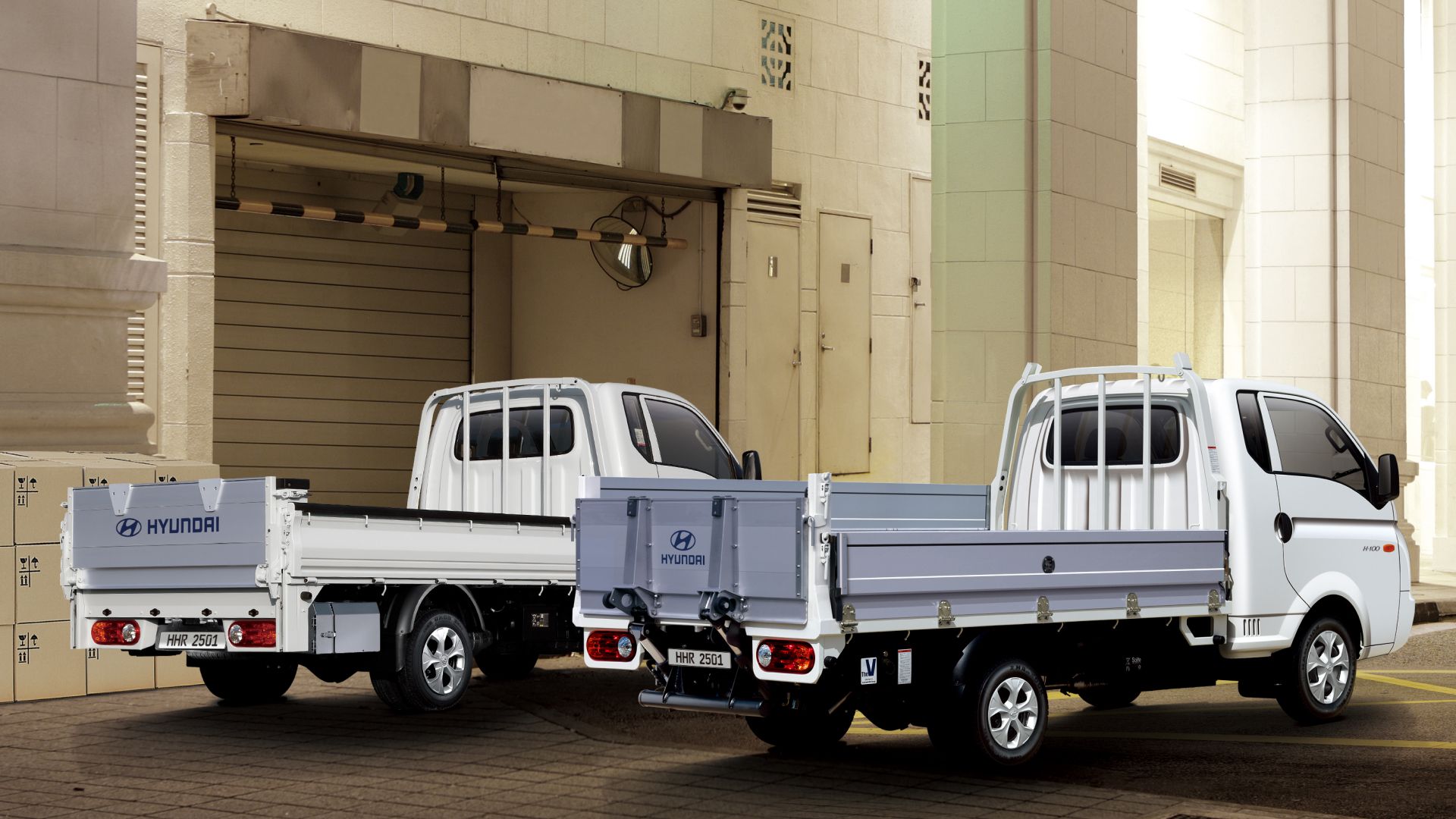 Rear photo of a power gate and transformer power gate vehicle parked at a shipping location