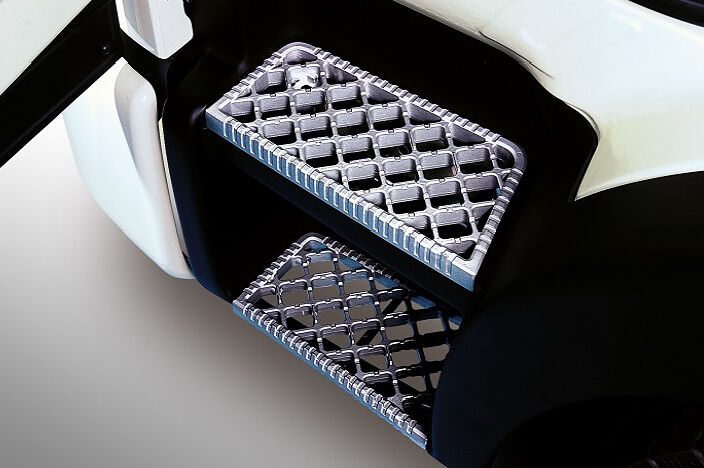 image focused on 2 aluminum safety steps