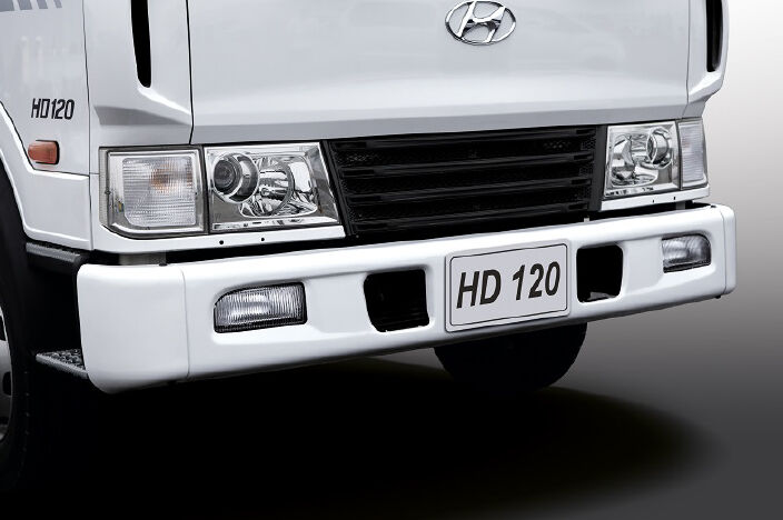 image of front bumper, fog lamps, headlamps and radiator grill