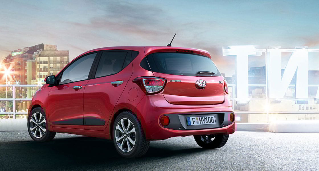 Side rear view of red i10 parked outdoor