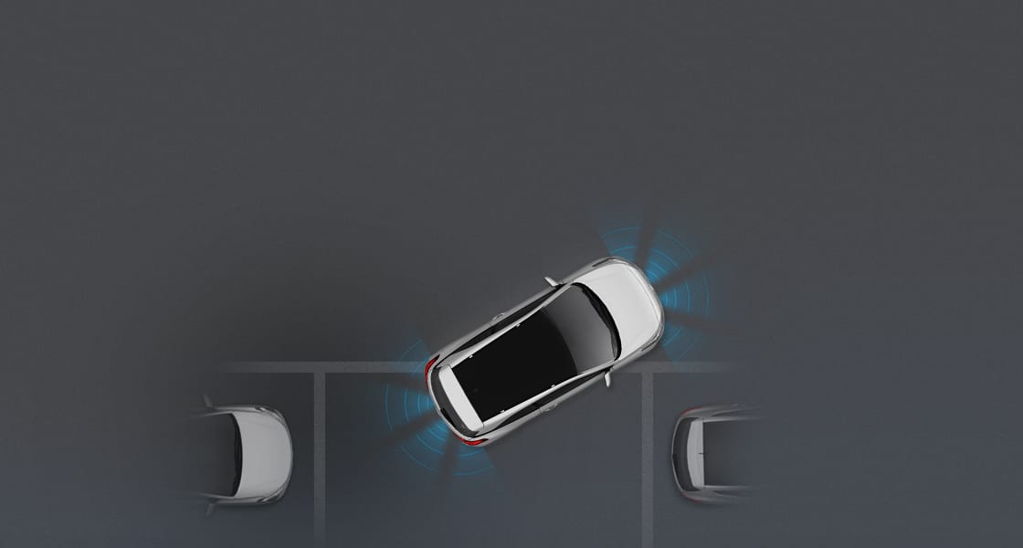 Top view of white i20 Coupe parallel parking with front and rear parking assist system