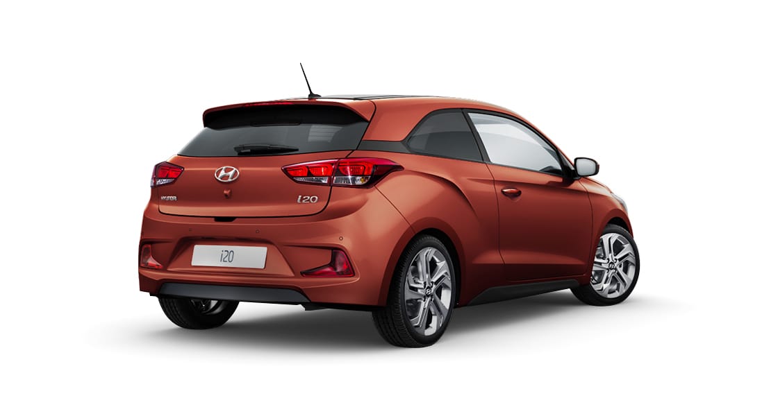 Rear side view of orange i20 Coupe