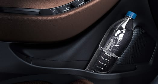 A bottle of water stored in the door panel