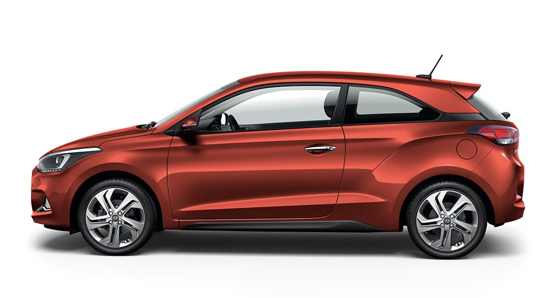 Left side view of orange i20 coupe