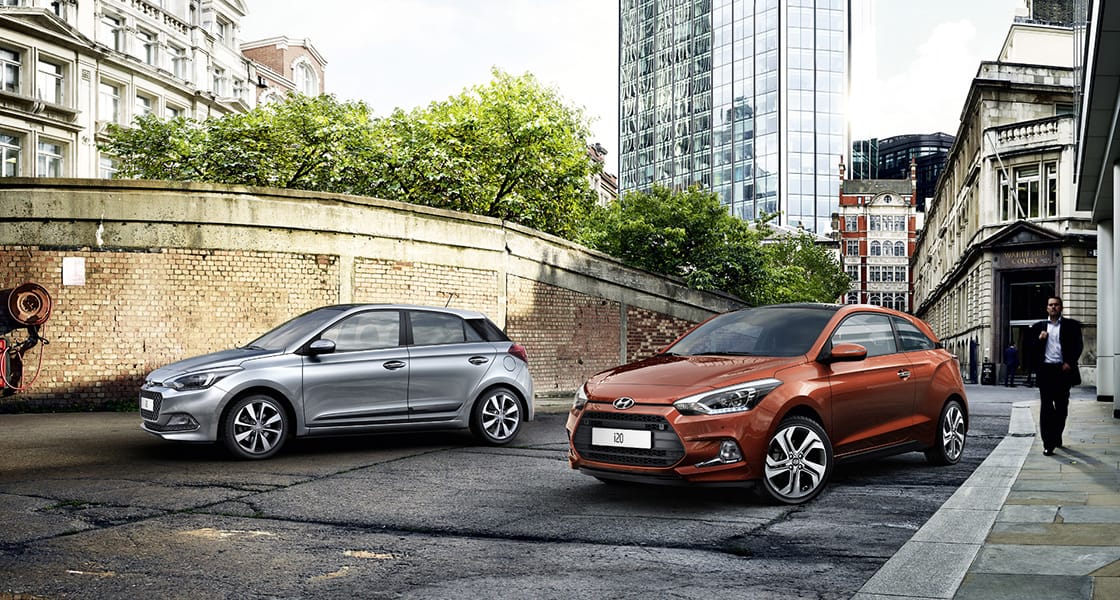 Side view of two i20 coupe on the street