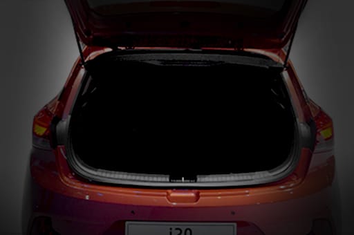 Rear view of orange i20 Coupe with trunk door fully opened