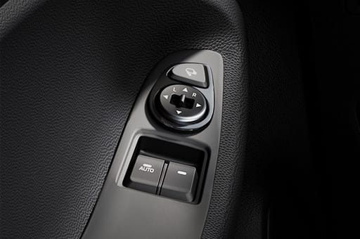 Power window adjustment control on the armrest