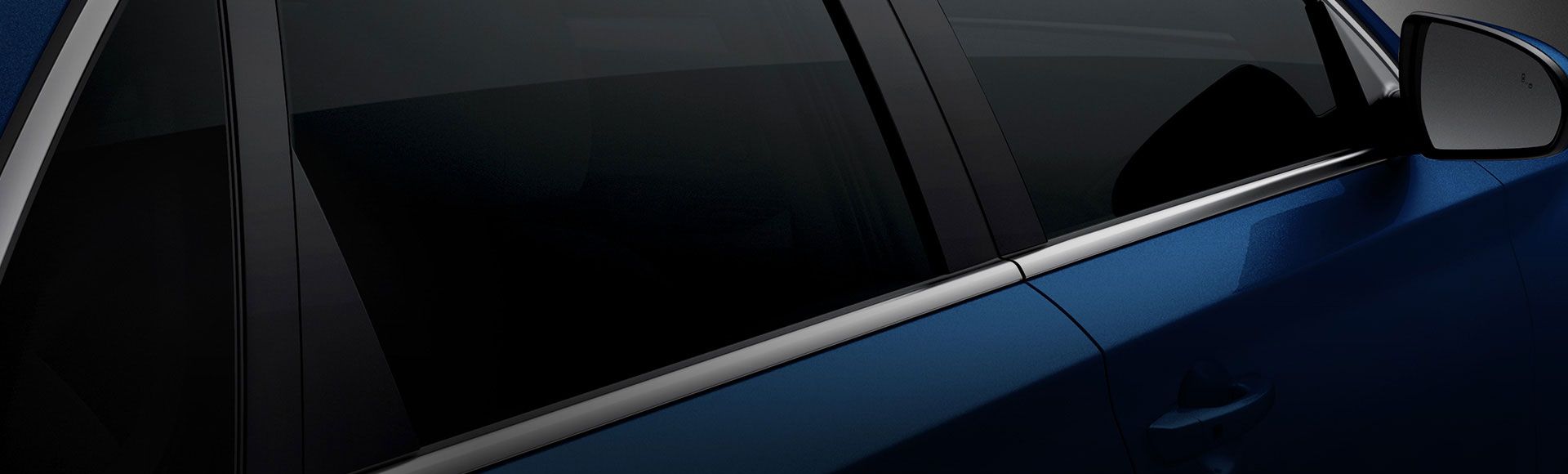 Closer view of right side rear view of blue i30 on the road