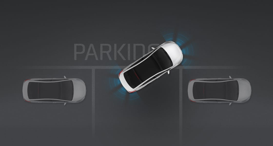 Top view of white i40 Sedan parking with assist system