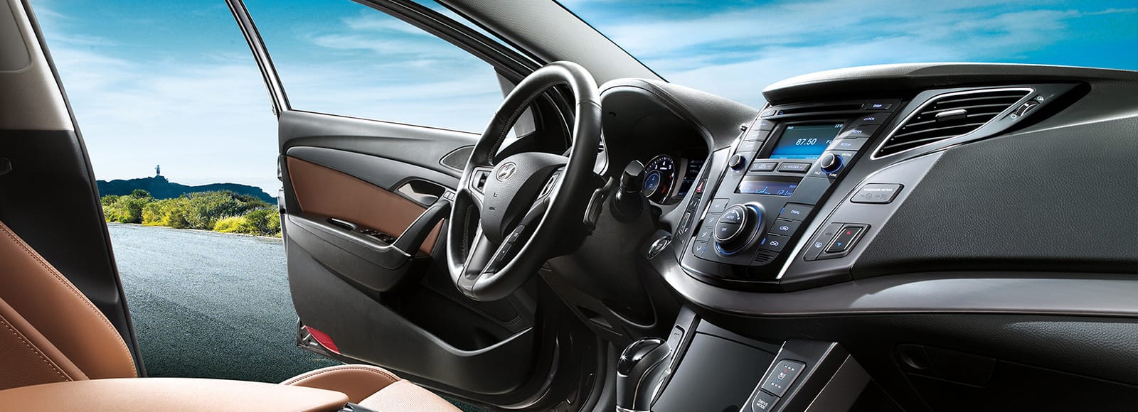 Panoramic view of front interior with driver side door opened