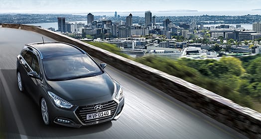 Sky view of i40 driving on the highway with city view behind