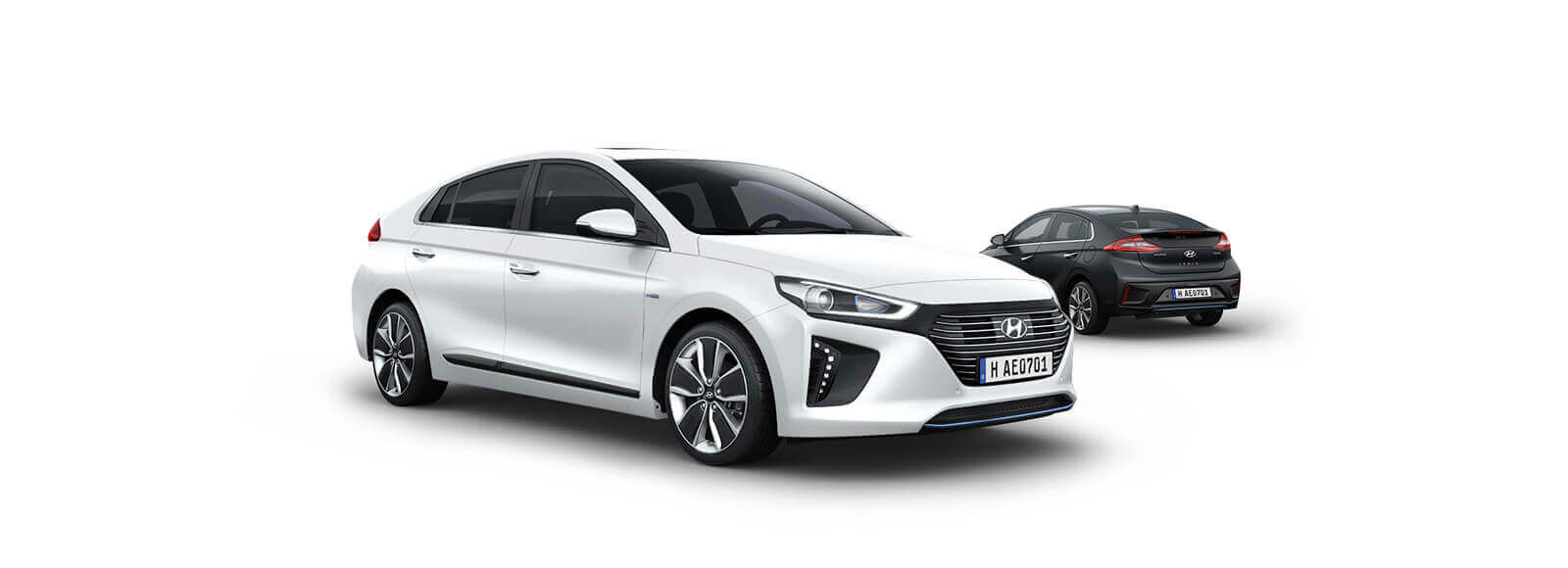 Side view of white Ioniq Hybrid in front and black Ioniq Hybrid parked behind