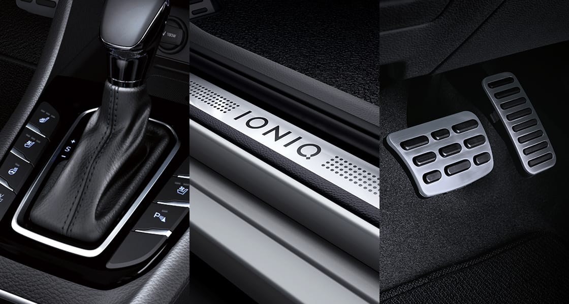 Closer view of gear knob, pedals and door scuff plates