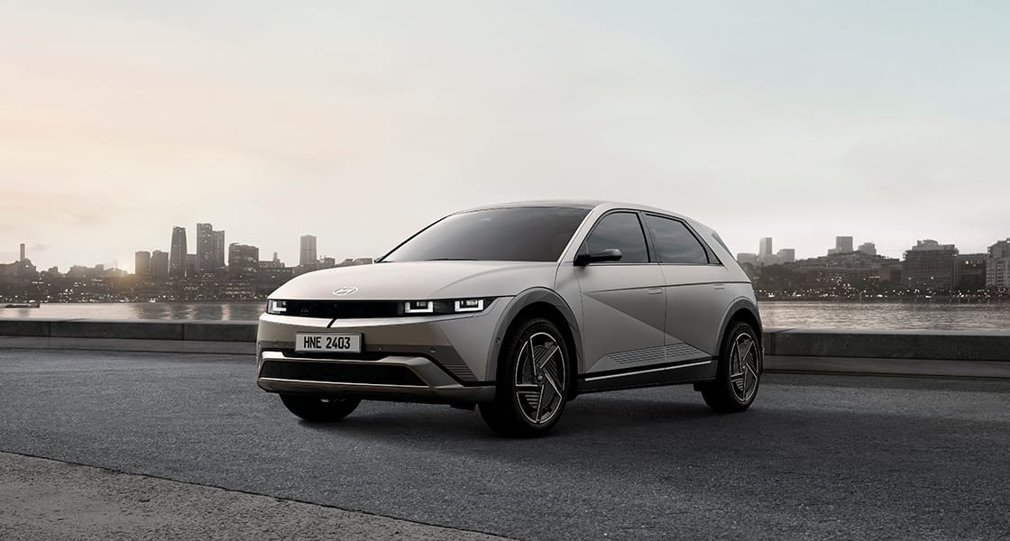 The side of a vehicle parked next to the river