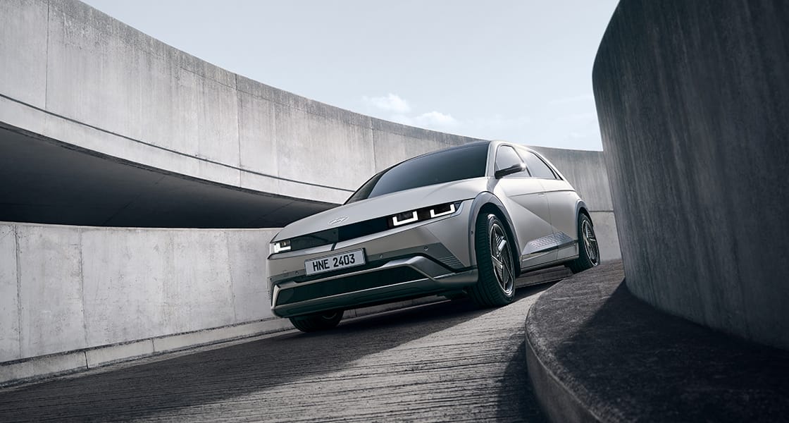 A vehicle descending a curved downhill road