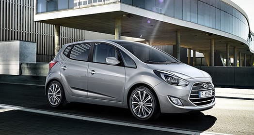 Side view of light gray ix20 on the street