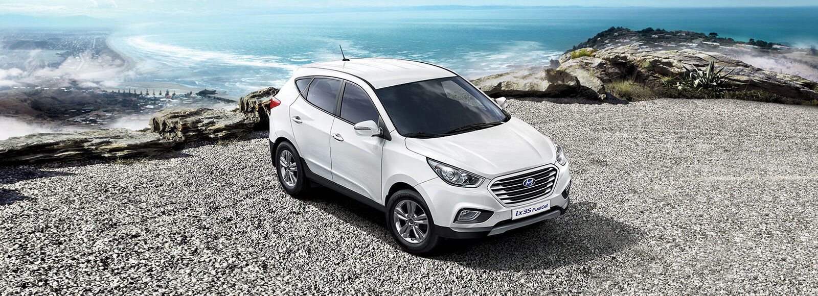 https://www.hyundai.com/content/dam/hyundai/template_en/en/images/find-a-car/pip/ix35-fuel-cell/exterior/ix35-fuel-cell-design-side-front-white-parked-seashore-white-pc.jpg