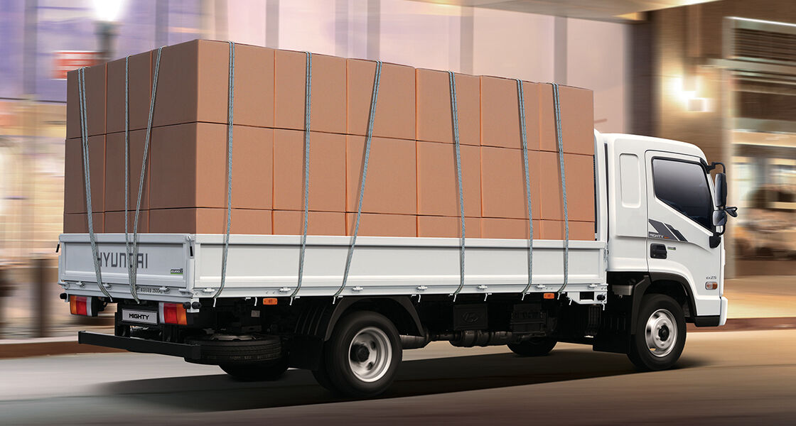 Side view of Mighty with many boxes loaded on the bed