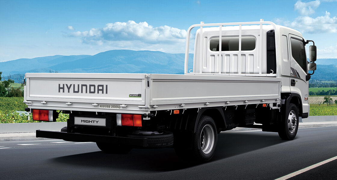 Side rear view of Mighty driving on the road