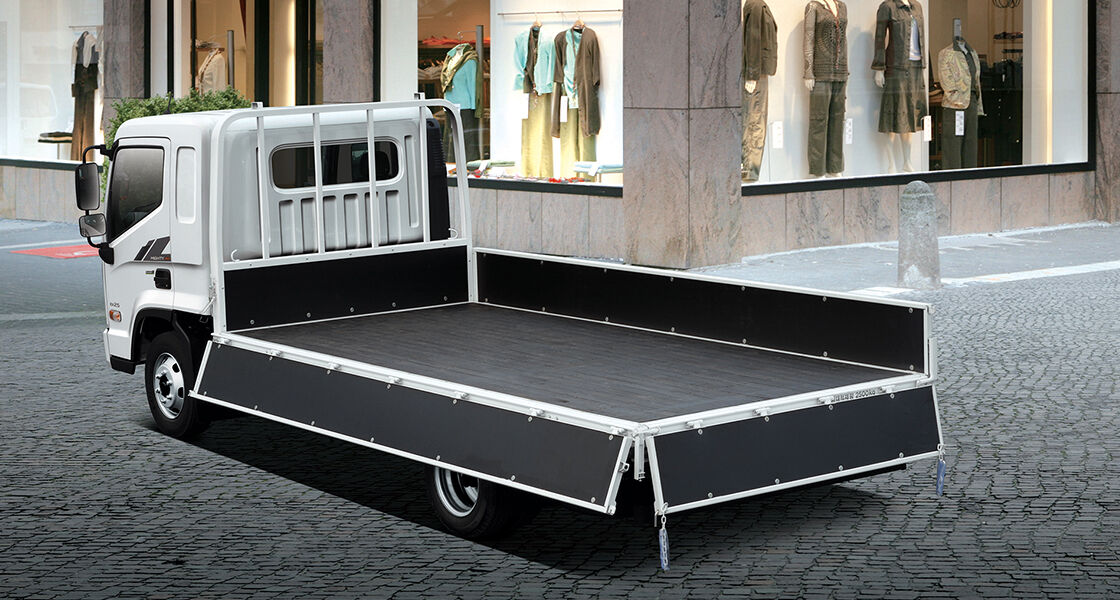 Side rear view of Mighty with bed doors opened