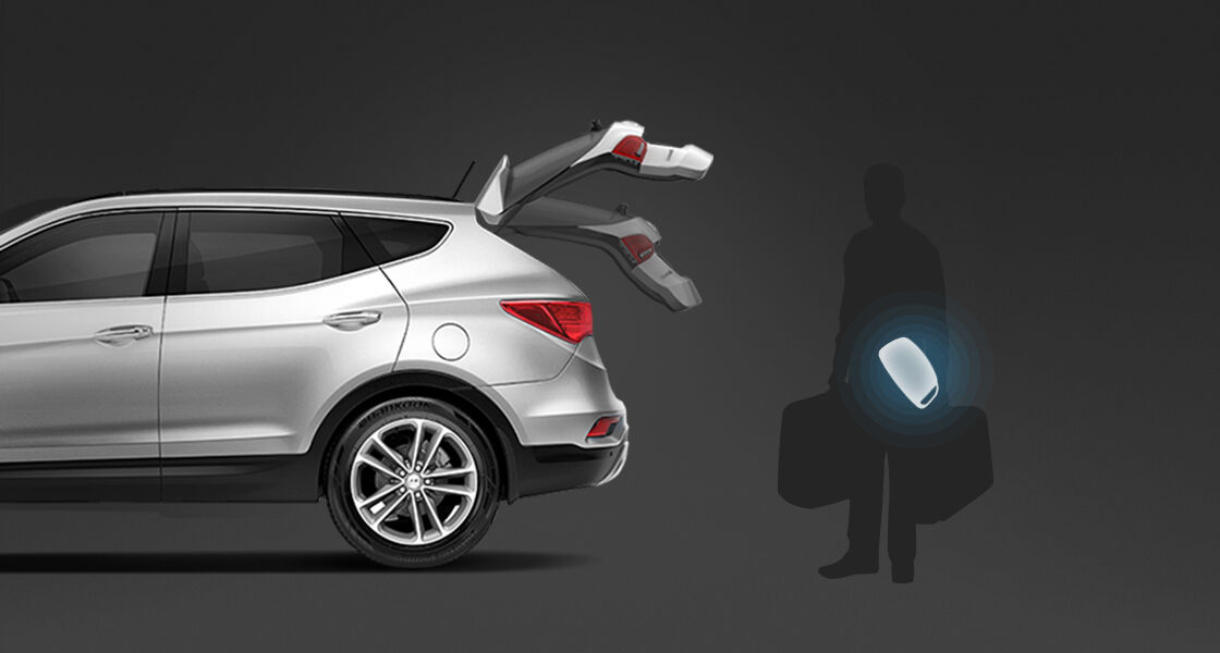 Side view of Santa Fe with trunk door opened