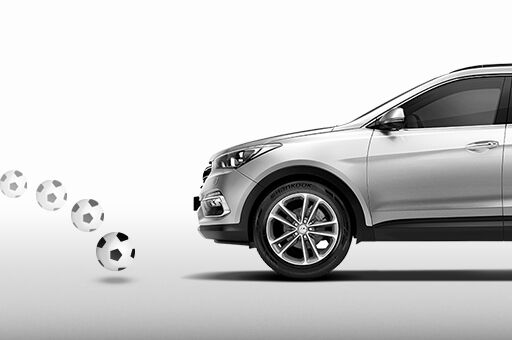 Brake assist system detects soccer ball in front of silver Santa Fe