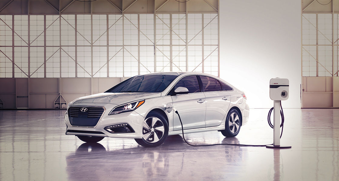 Side front view of Sonata Plug-in Hybrid getting charged