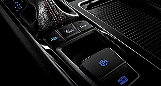 Control buttons below the gear shift lever