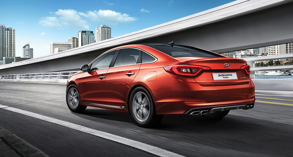 Left side rear view of red Sonata Turbo