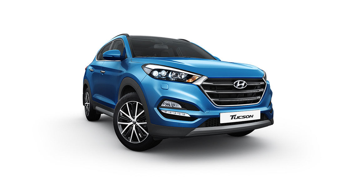 Side front view of blue Tucson