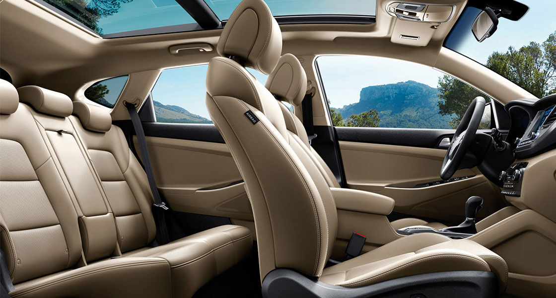 Beige color interior view of front seats from passenger's viewpoint