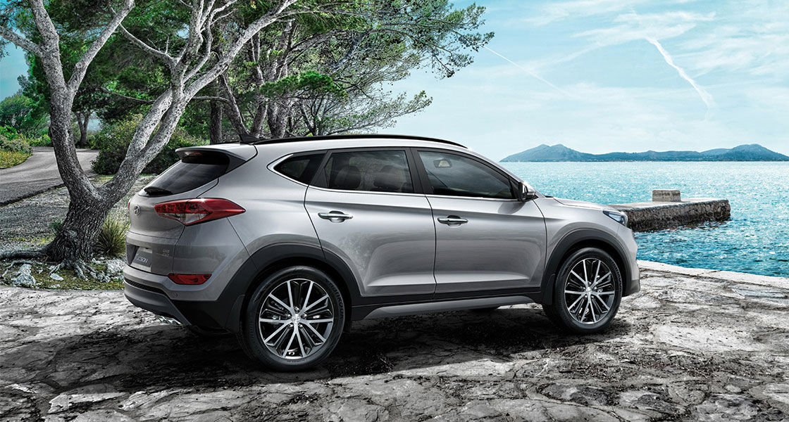 Side view of silver Tucson parked