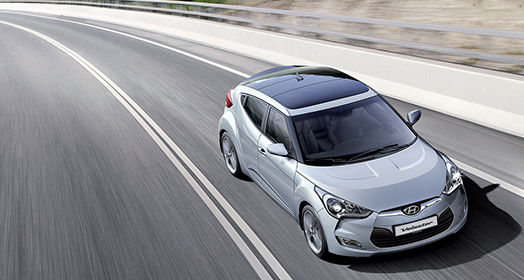 Sky view of silver Veloster driving on the road