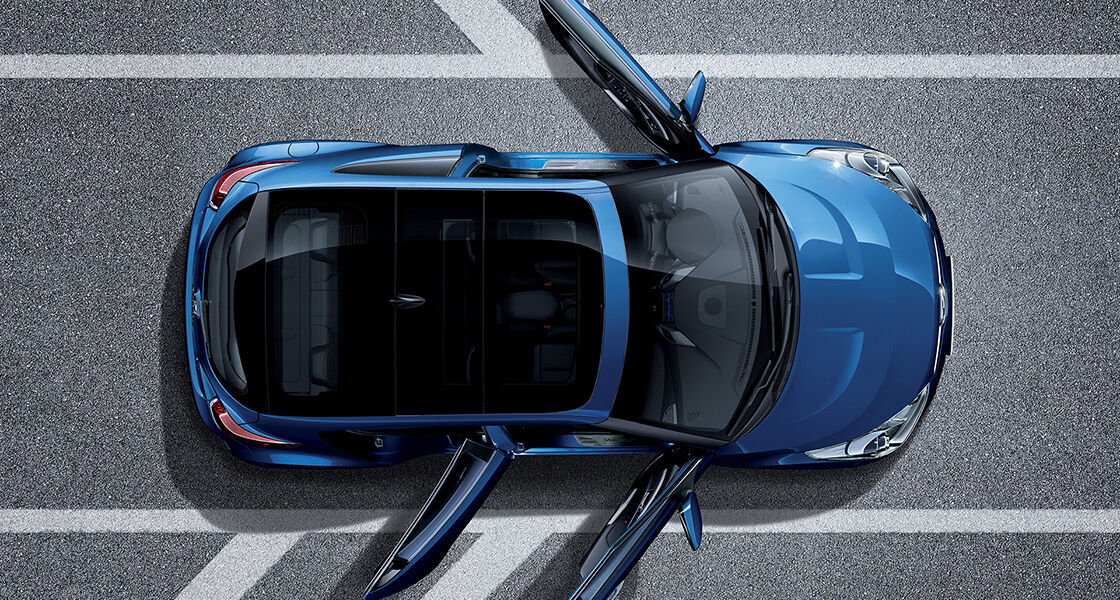 Top view of veloster with one door on the driver's side, two on the passenger's side opened