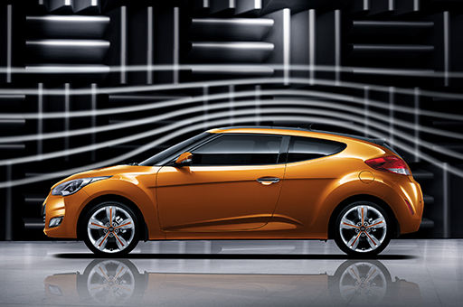 Side view of tangerine Veloster
