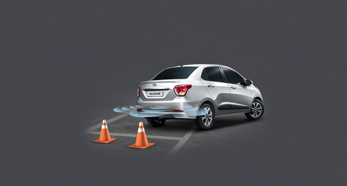 Silver Xcent parking with rear parking assist system
