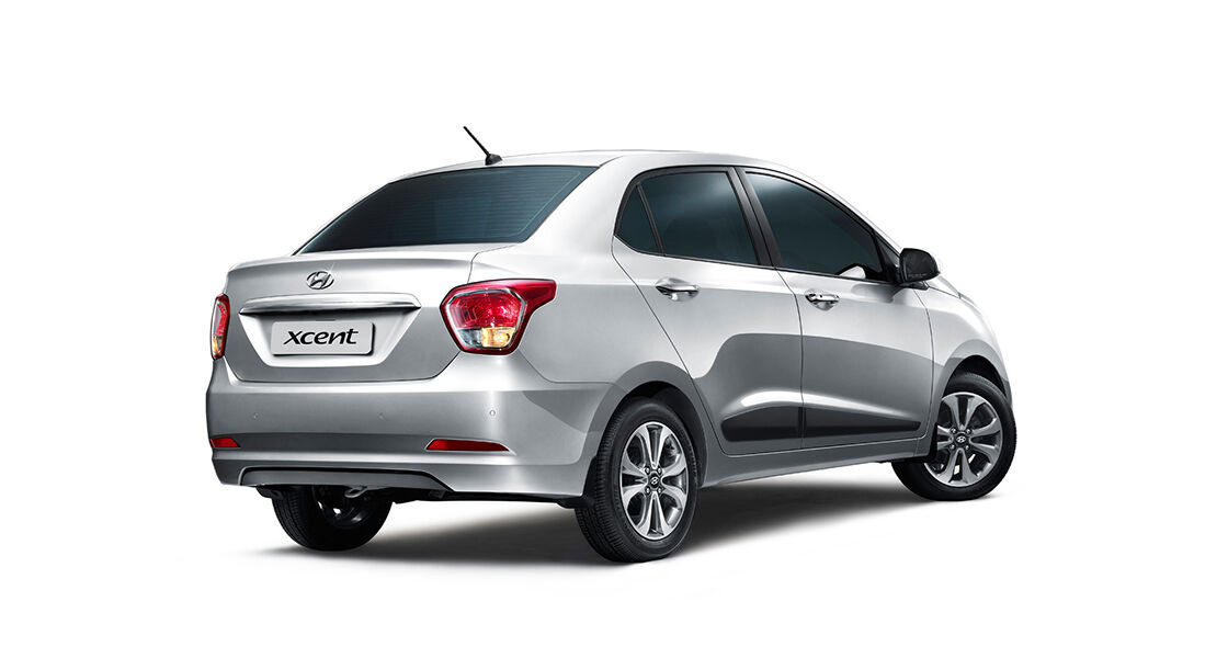 Right side rear view of silver Xcent
