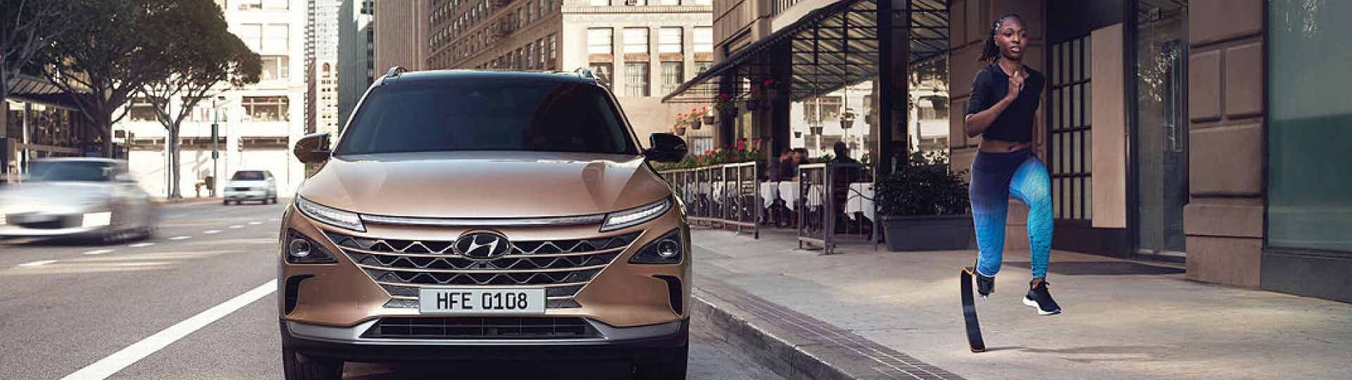 Fuel Cell Electric : A Woman Running Alongside Nexo