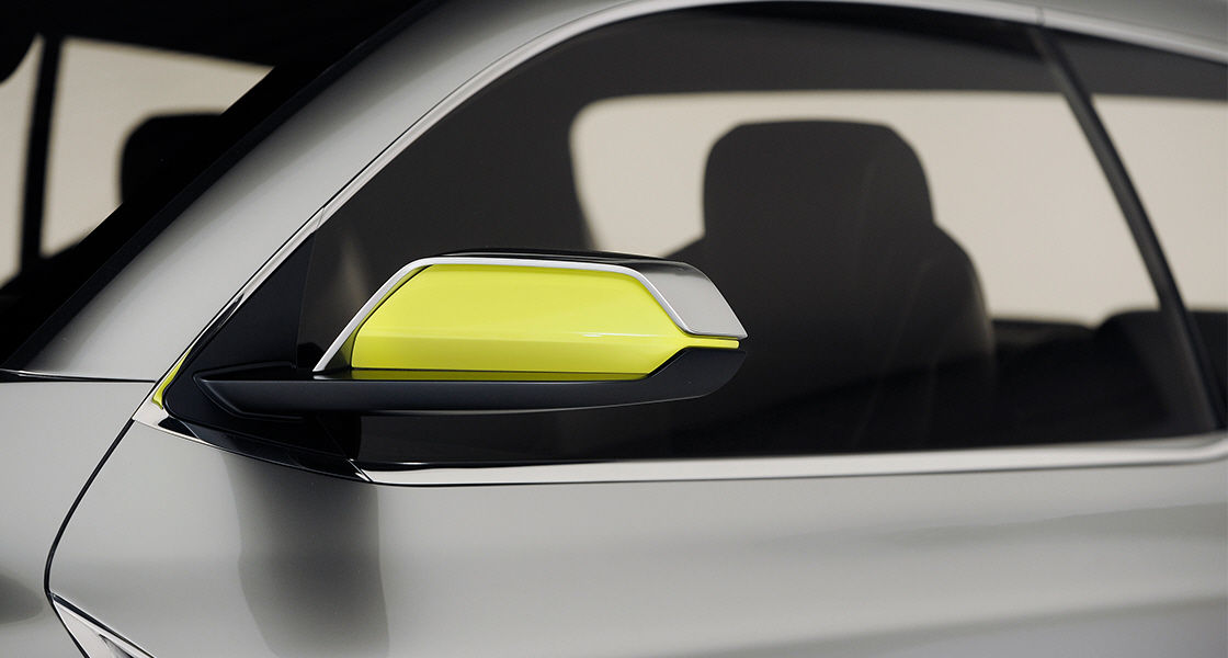 Closer view of the side of 2015 Santa Cruz with yellow side mirror