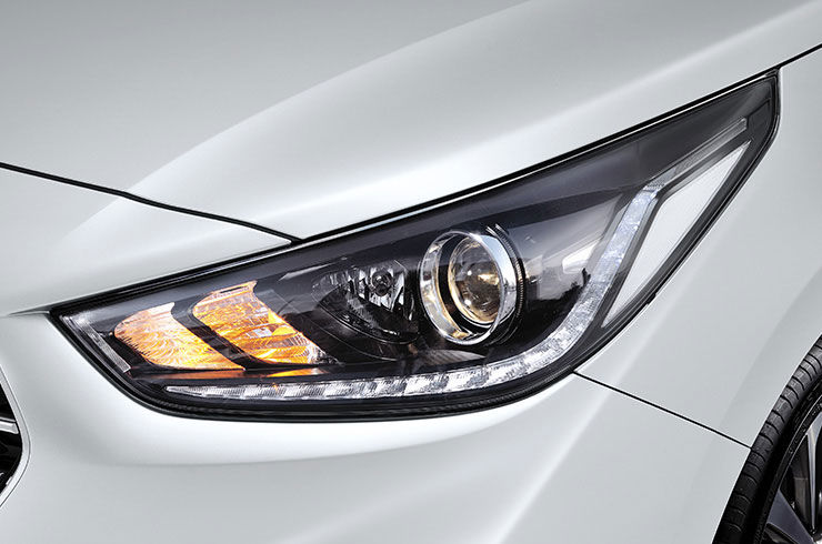 Projection headlamps with LED positioning lamps