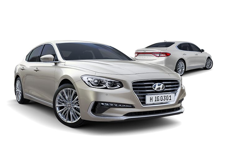 Side view of beige Azera in front and beige Azera parked behind