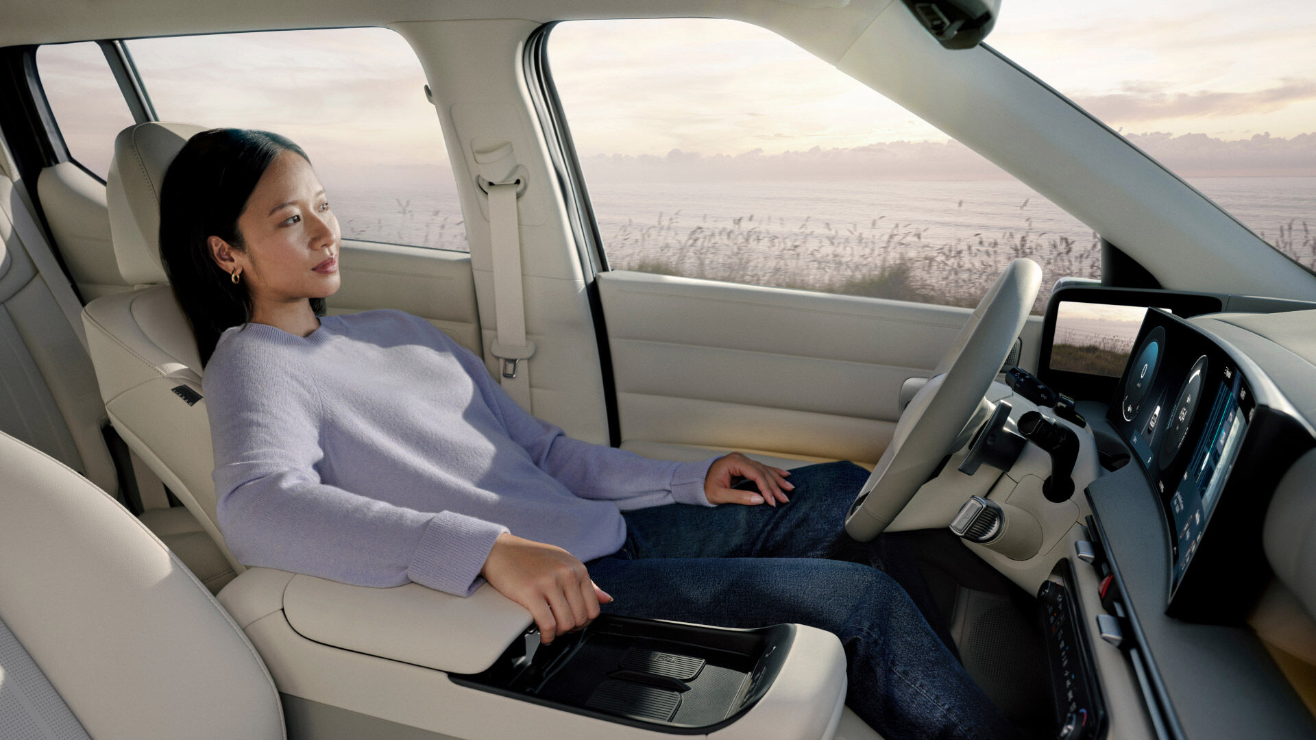 A woman relaxing in the spacious front row of the all-new NEXO