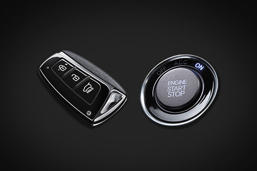 smart key on the left and engine start and stop button on the right
