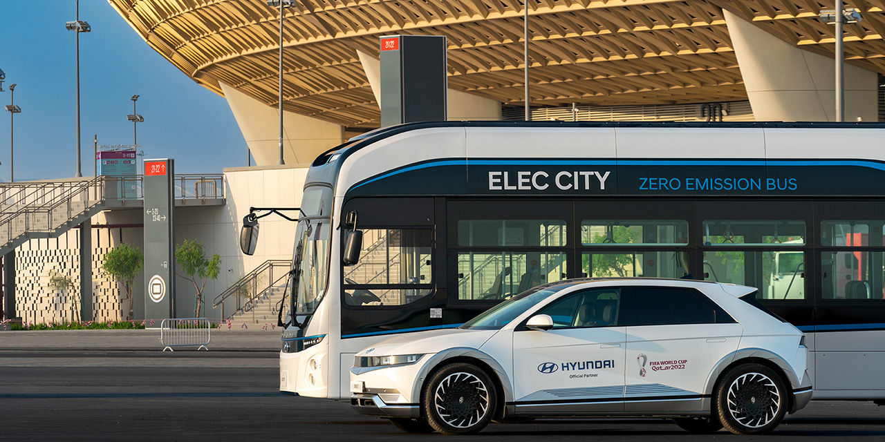 Hyundai motor company's car standing in front of a bus stop at lusail stadium