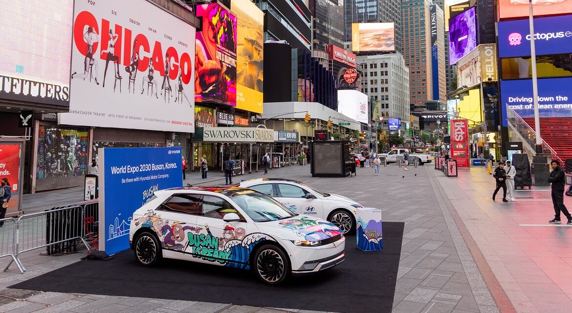 Hyundai IONIQ 5 (left) and IONIQ 6 (right) art cars are exhibited at Duffy Square, a majora major landmark in Times Square, showing graffiti artwork and the slogan to promote Busan's bid to host the 2030 World Expo