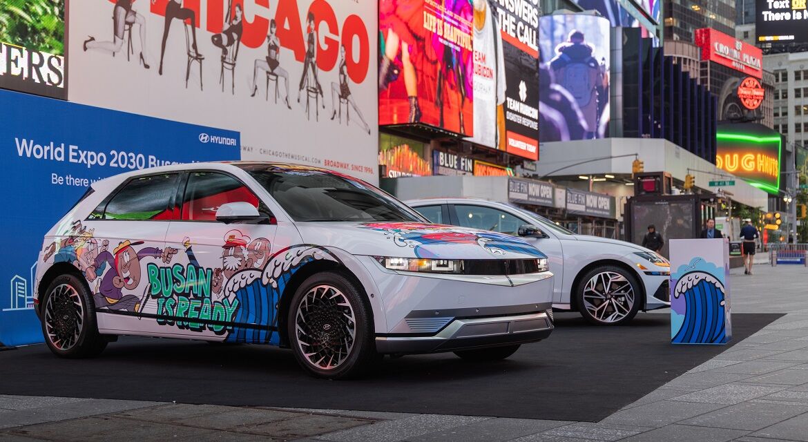 Hyundai IONIQ 5 (left) and IONIQ 6 (right) art cars are exhibited at Duffy Square, a majora major landmark in Times Square, showing graffiti artwork and the slogan to promote Busan's bid to host the 2030 World Expo
